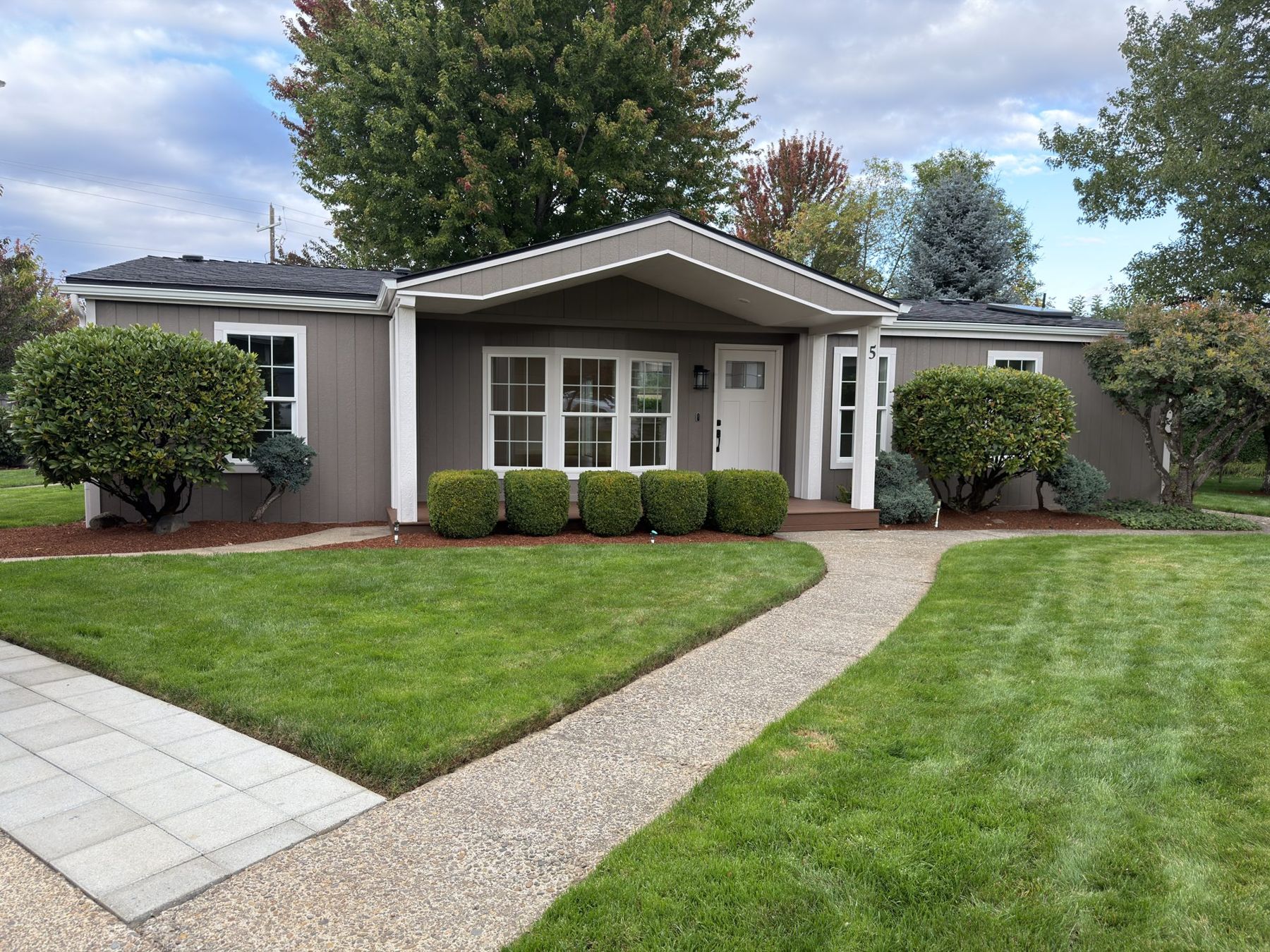 Front of the home — new roof, LP SmartSide siding, covered Trex porch, fresh landscaping